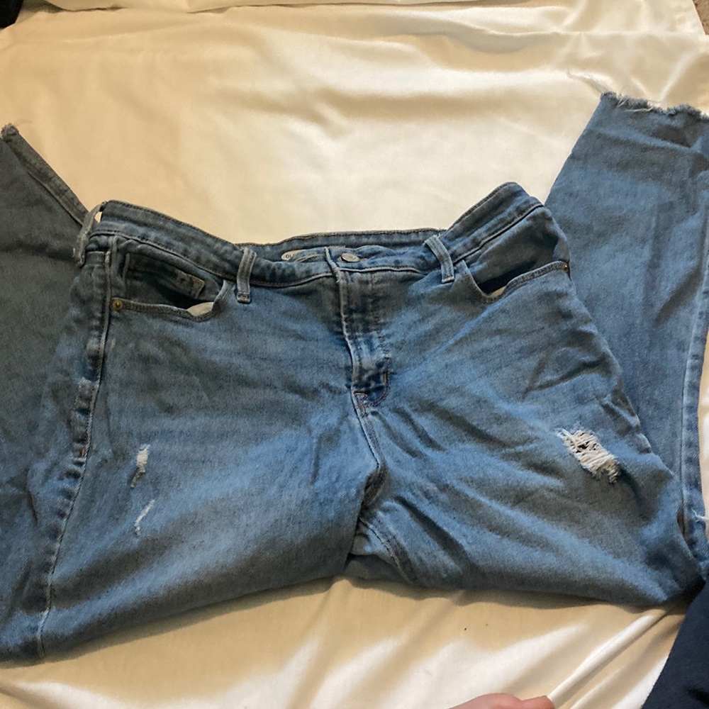 Ripped old navy blue jeans